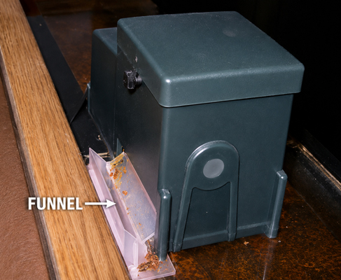Installation of moisture trap funnel on aquarium