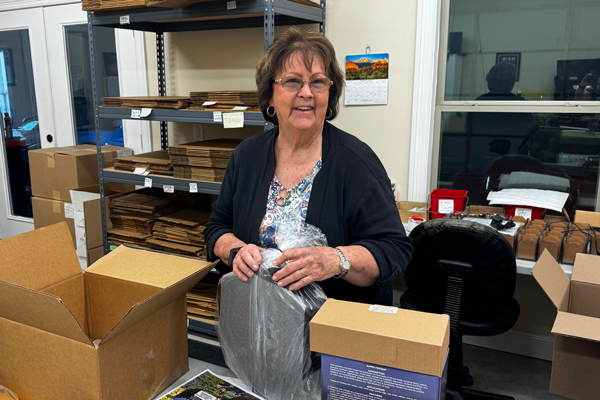 Momma Grace packing Super Feeders in our shipping location