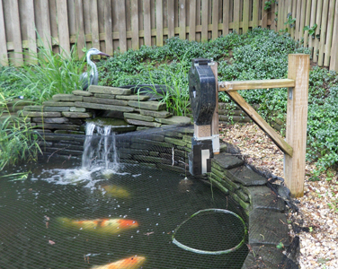 koi pond feeder mounted to 2x4
