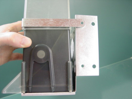bracket and strap mounted to bottom of automatic feeder